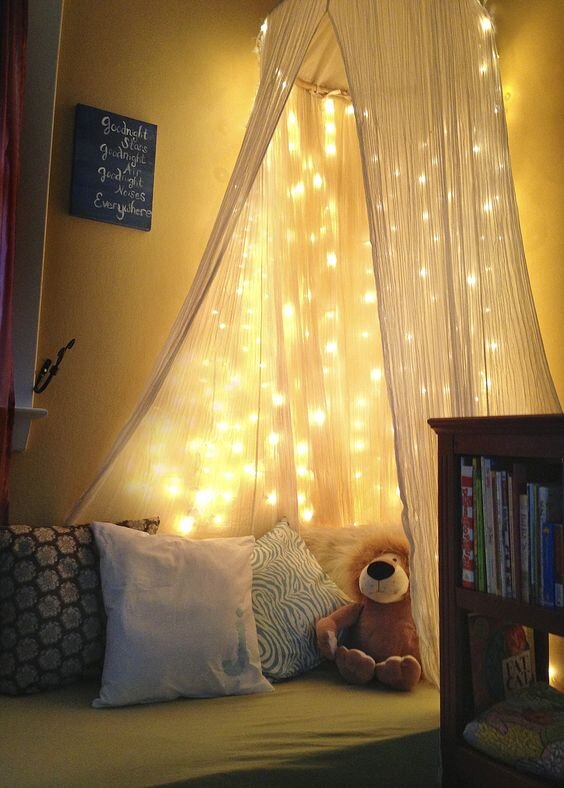 Kids reading nook with fairy lights